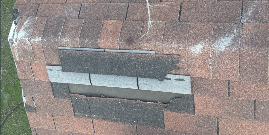Wind damage with missing shingles in Texas